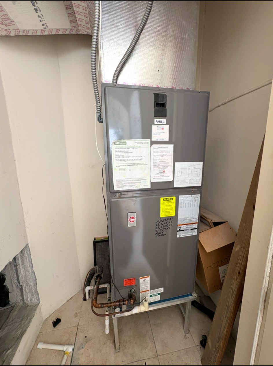 Old indoor HVAC air handler before replacement
